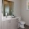 a bathroom with a mirror and sink